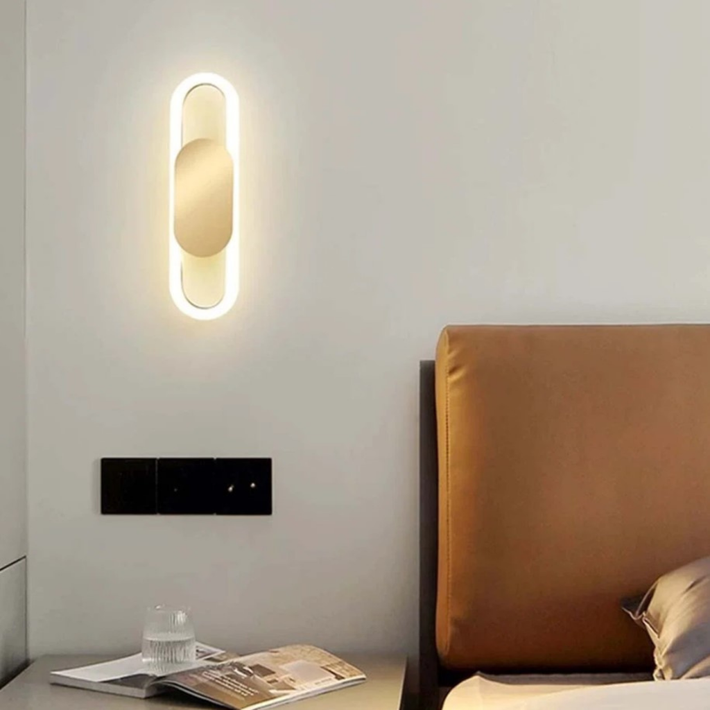 Modern oval LED wall light in a reading area