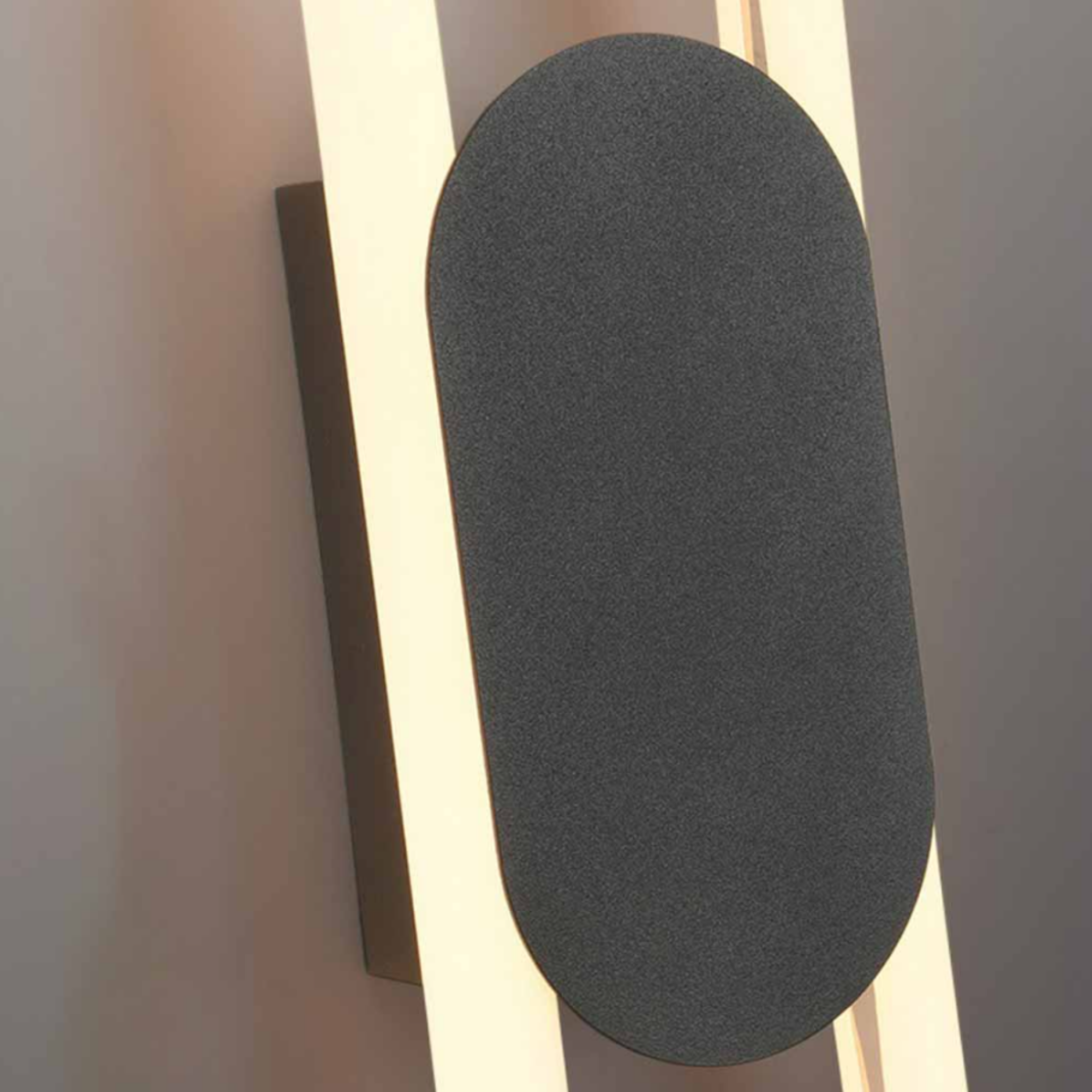 Close-up of the aluminum body of the oval wall sconce
