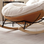 Detais of the modern leisure chair with curved backrest and rocking base