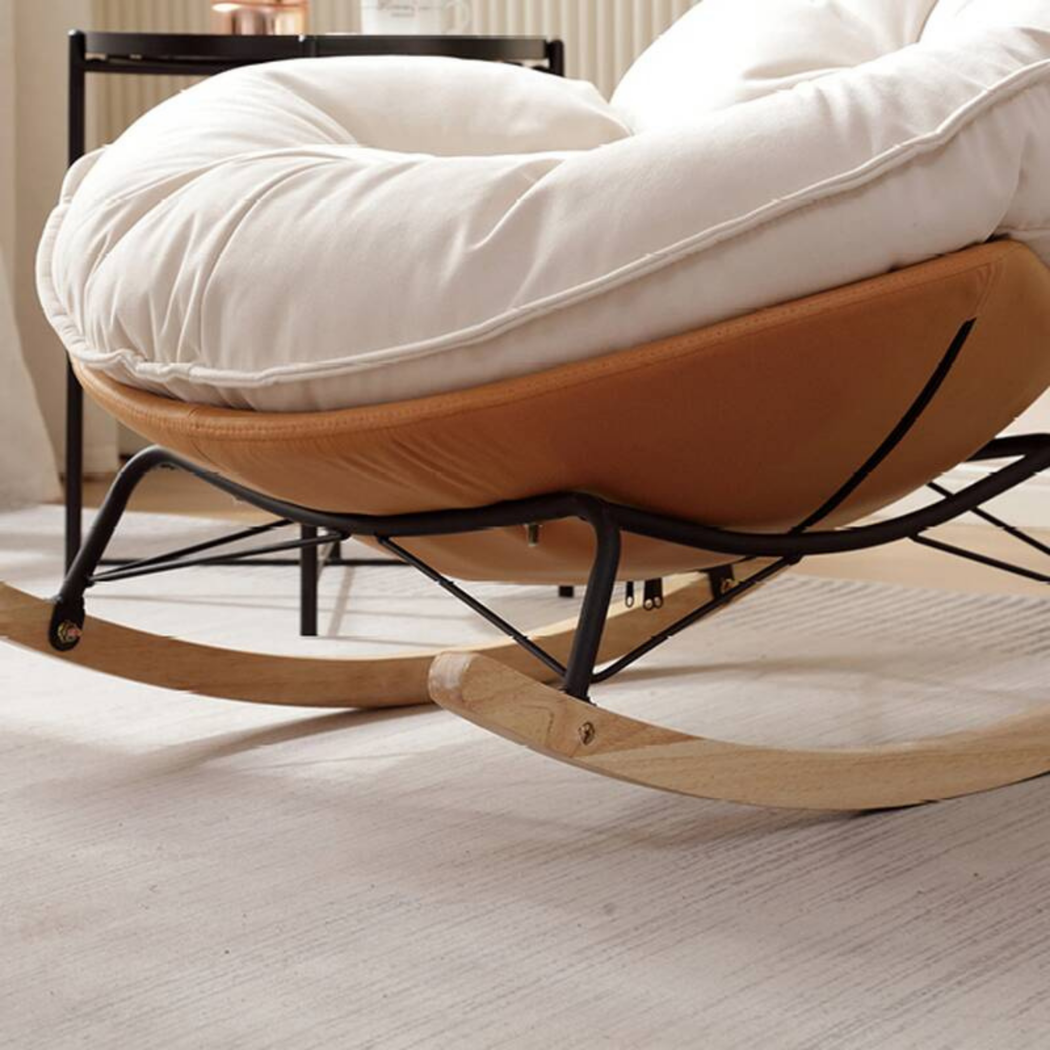 Detais of the modern leisure chair with curved backrest and rocking base