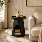 Modern round cream plastic side table with a minimalist design for use beside a sofa or bed in small living rooms and bedrooms.