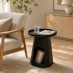 Modern round cream plastic side table with a minimalist design for use beside a sofa or bed in small living rooms and bedrooms.