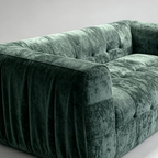 Angled view of tufted fabric sofa