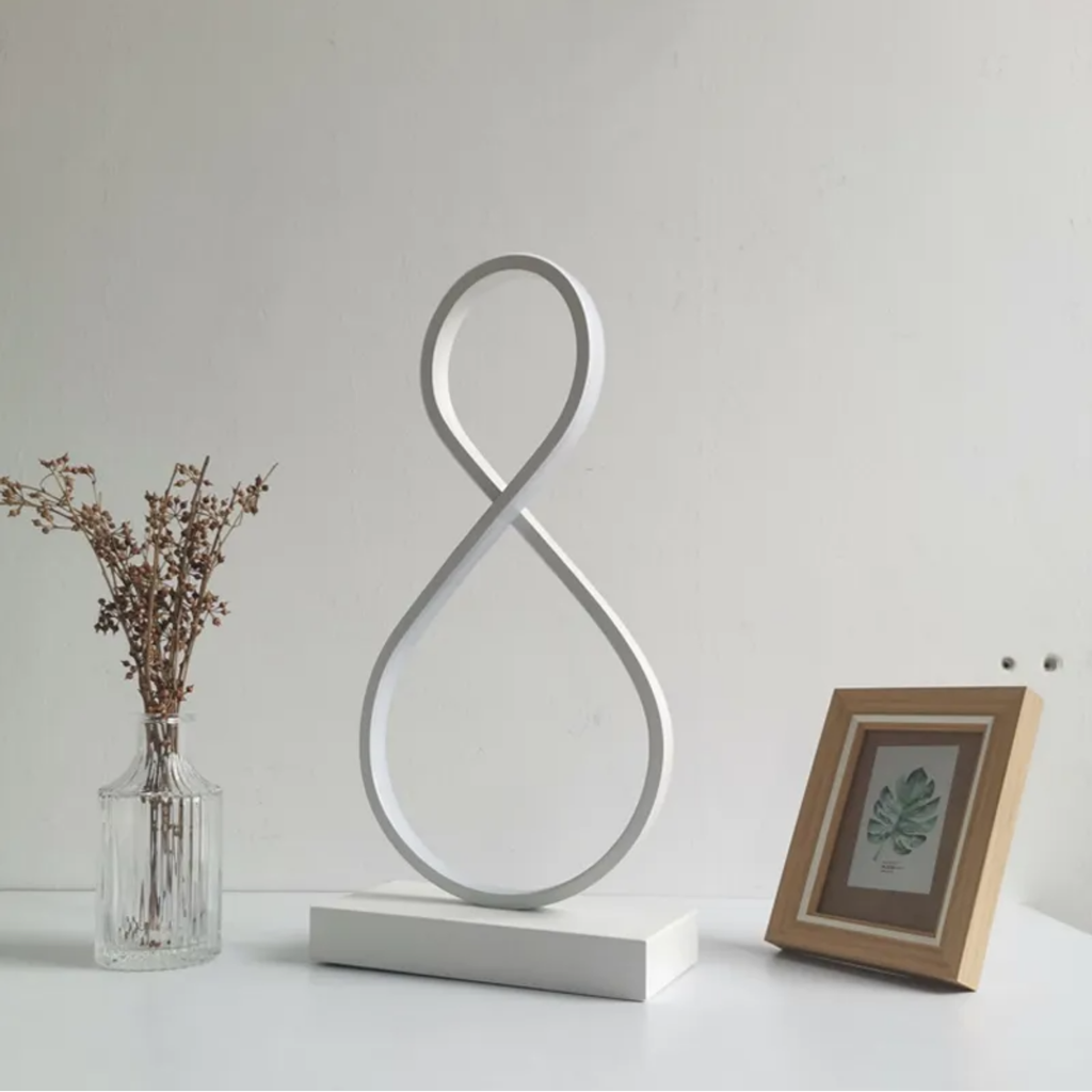 Modern spiral 8-shaped LED table lamp turned off