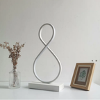 Modern spiral 8-shaped LED table lamp turned off