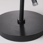 Base detail of modern spiral standing floor lamp