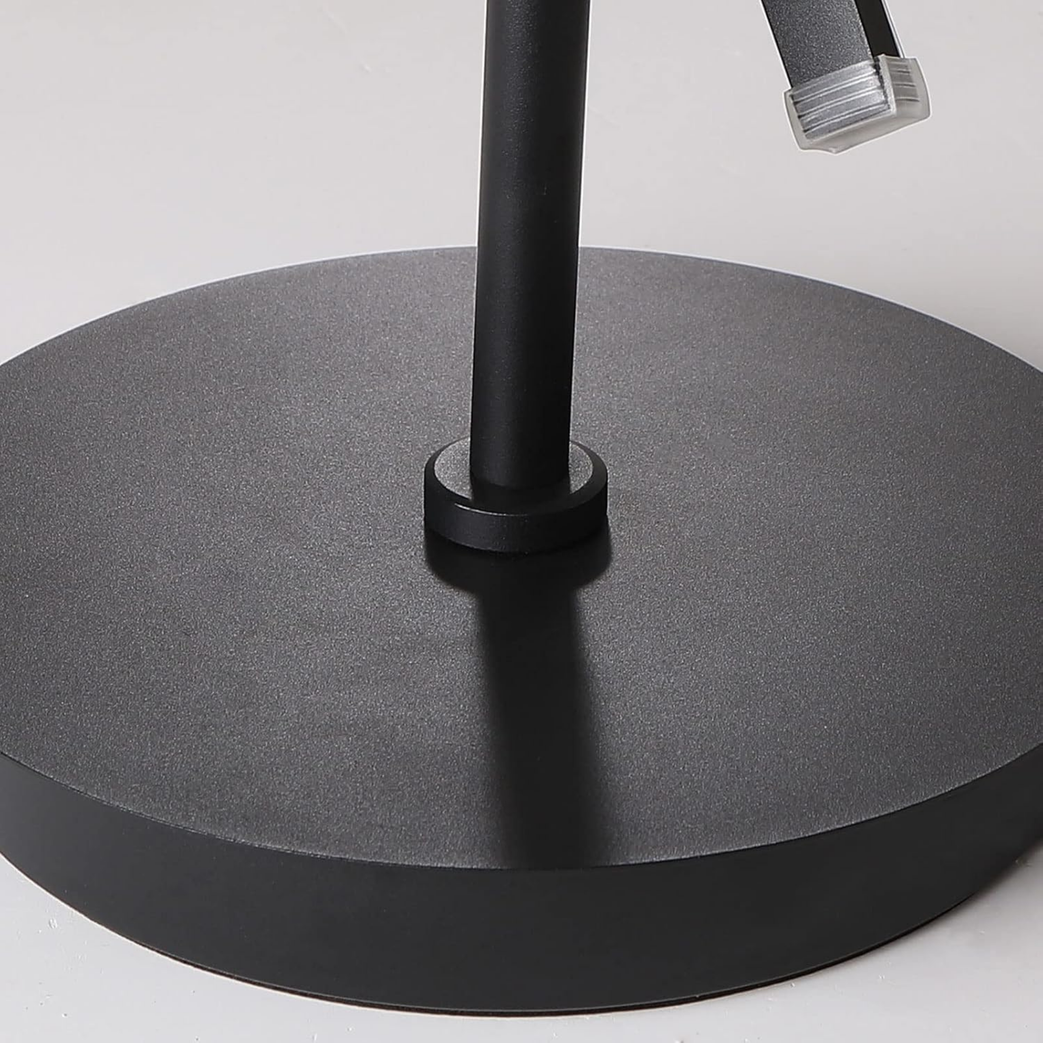 Base detail of modern spiral standing floor lamp