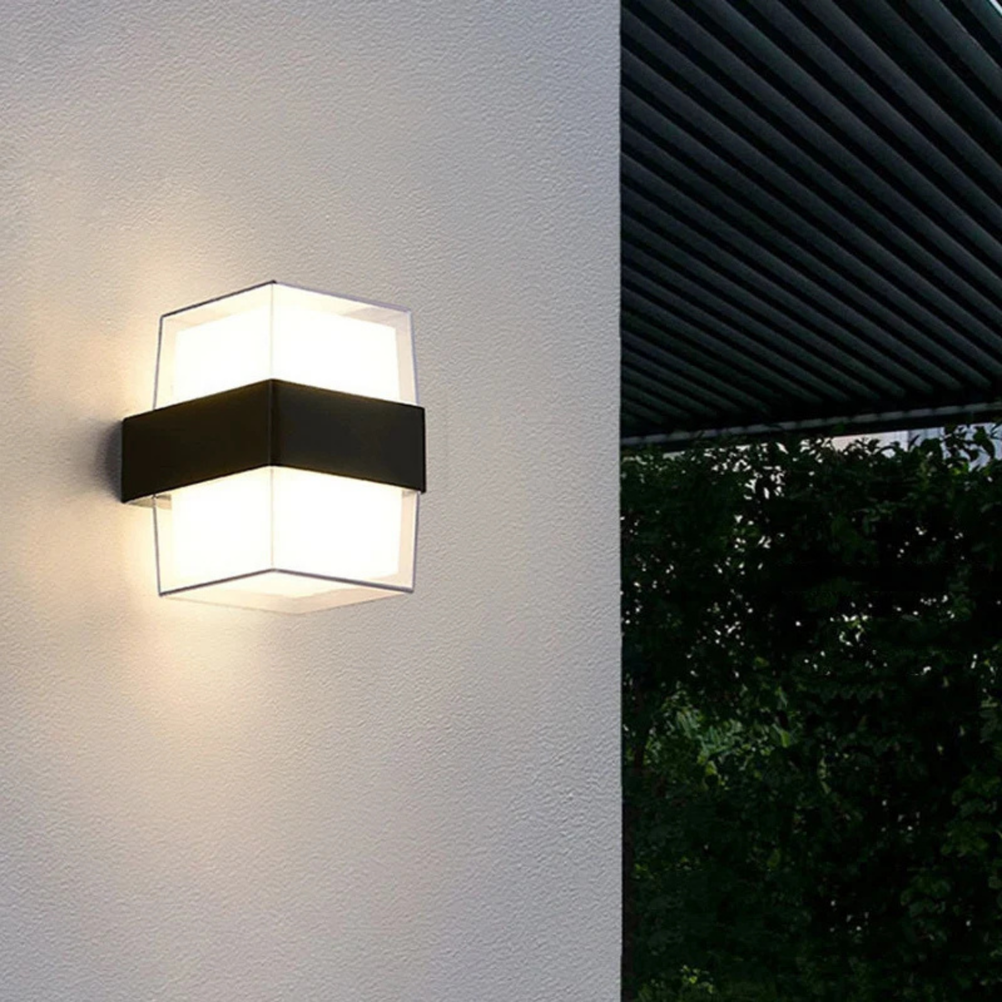 Modern square LED wall light in a garden