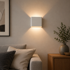 Modern square LED wall sconce in a living room