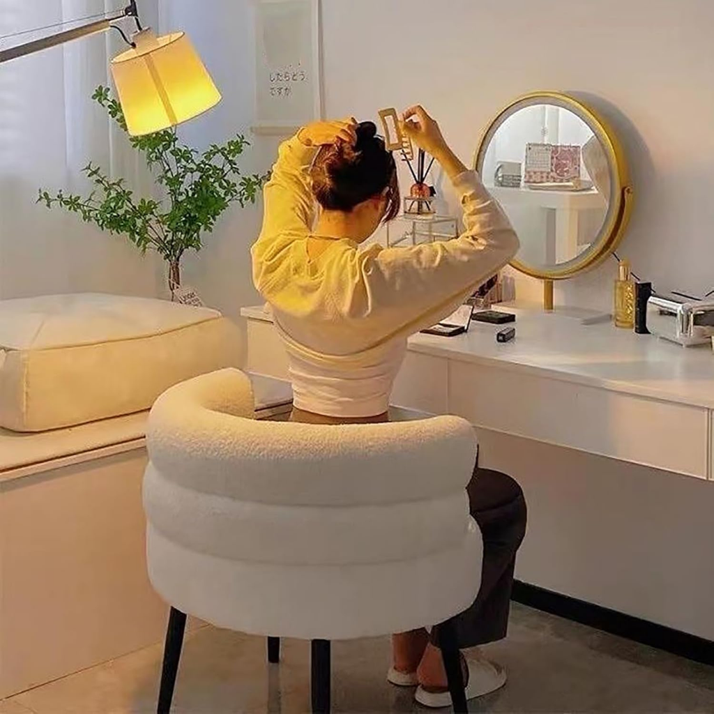 Woman sitting on the modern teddy fleece accent chair with metal legs
