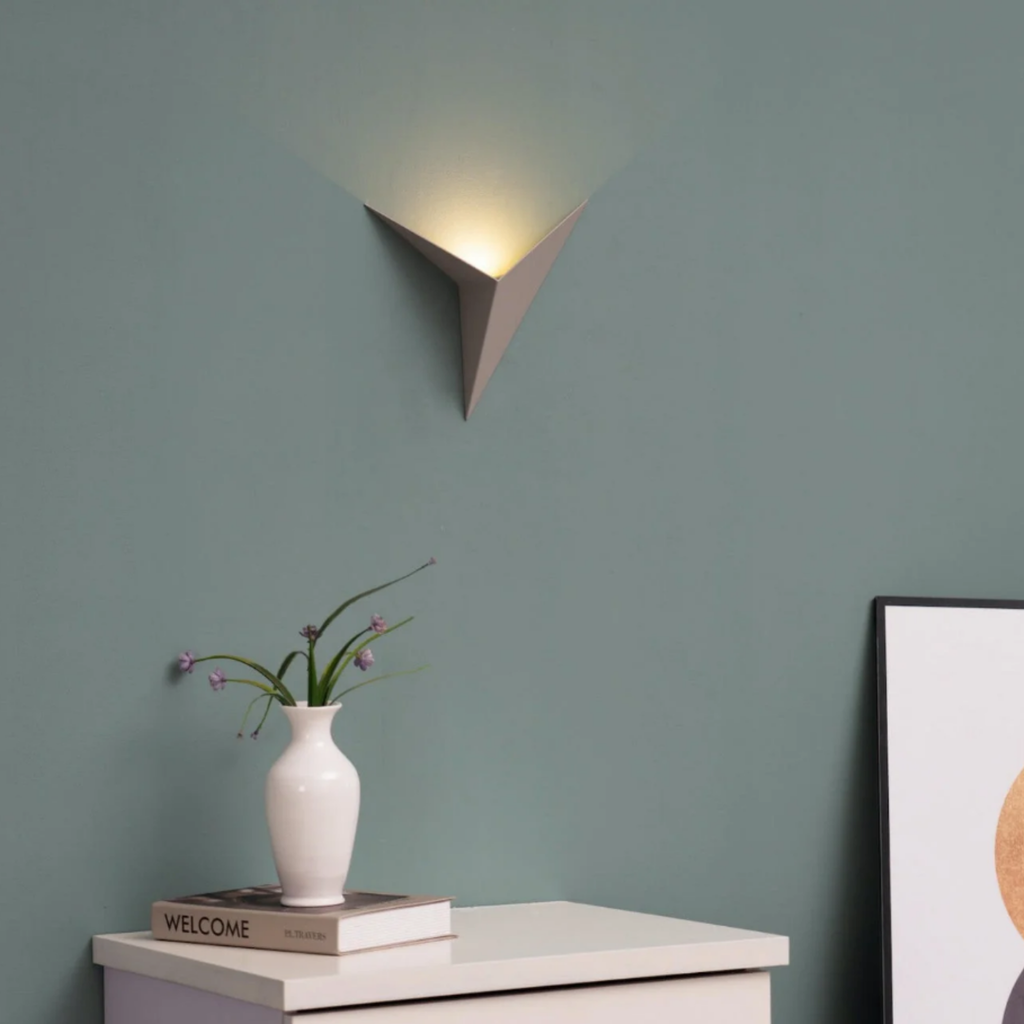 Modern triangle wall sconce in a contemporary interior