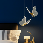 Nordic butterfly LED pendant 2 light above a bedside table