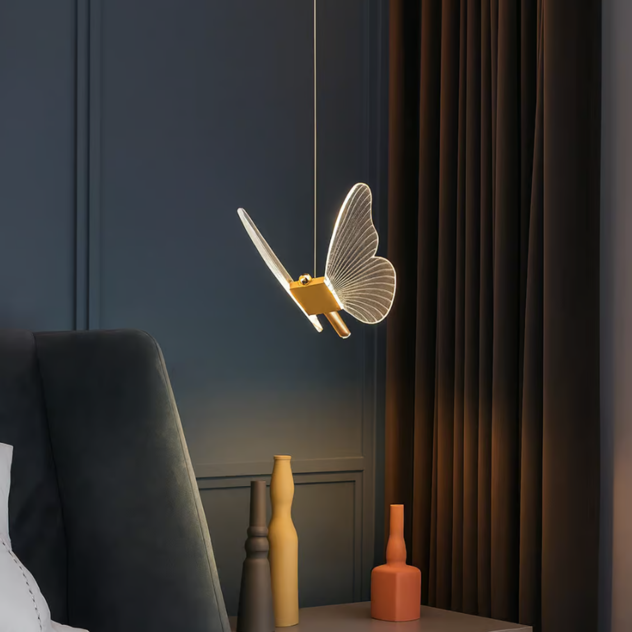 Nordic butterfly LED pendant light above a bedside table
