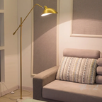 Nordic gold adjustable floor lamp in a living room