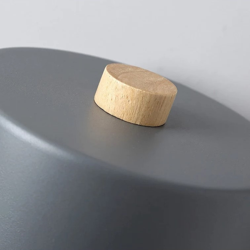 Detailed view of the iron finish on the wall light
