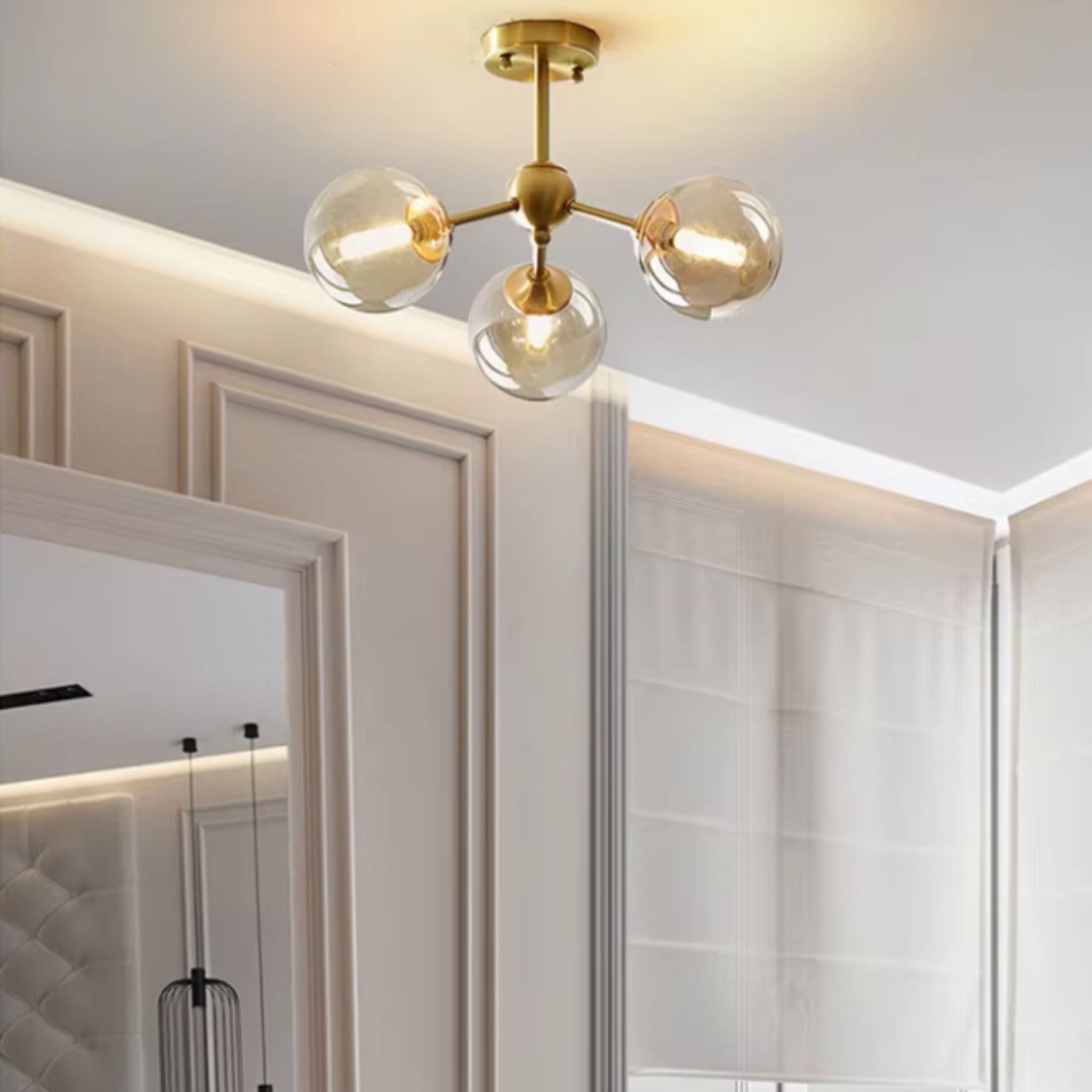 Modern Nordic copper pendant chandelier with amber glass in a bedroom