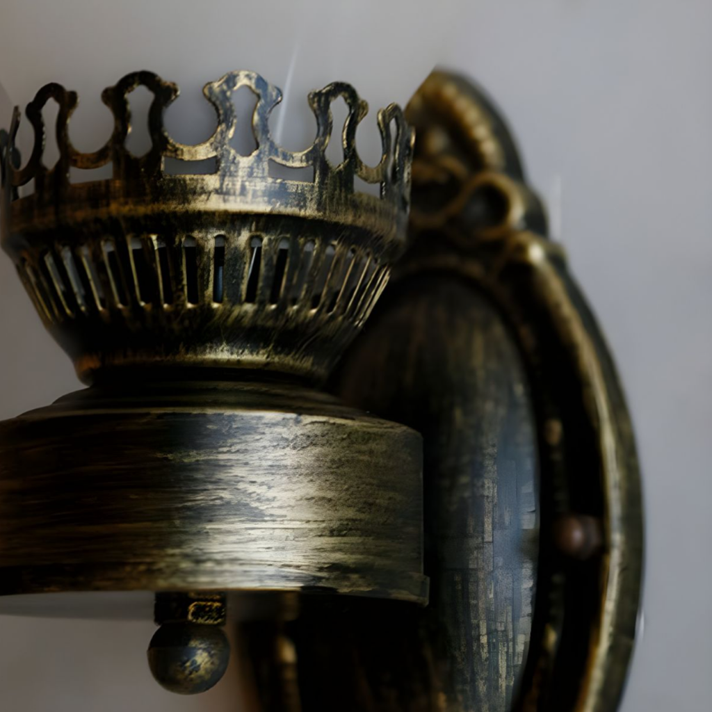 Detailed view of the metal frame on the vintage wall lamp