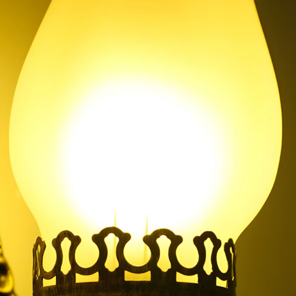 Close-up of the decorative glass shade on the wall sconce
