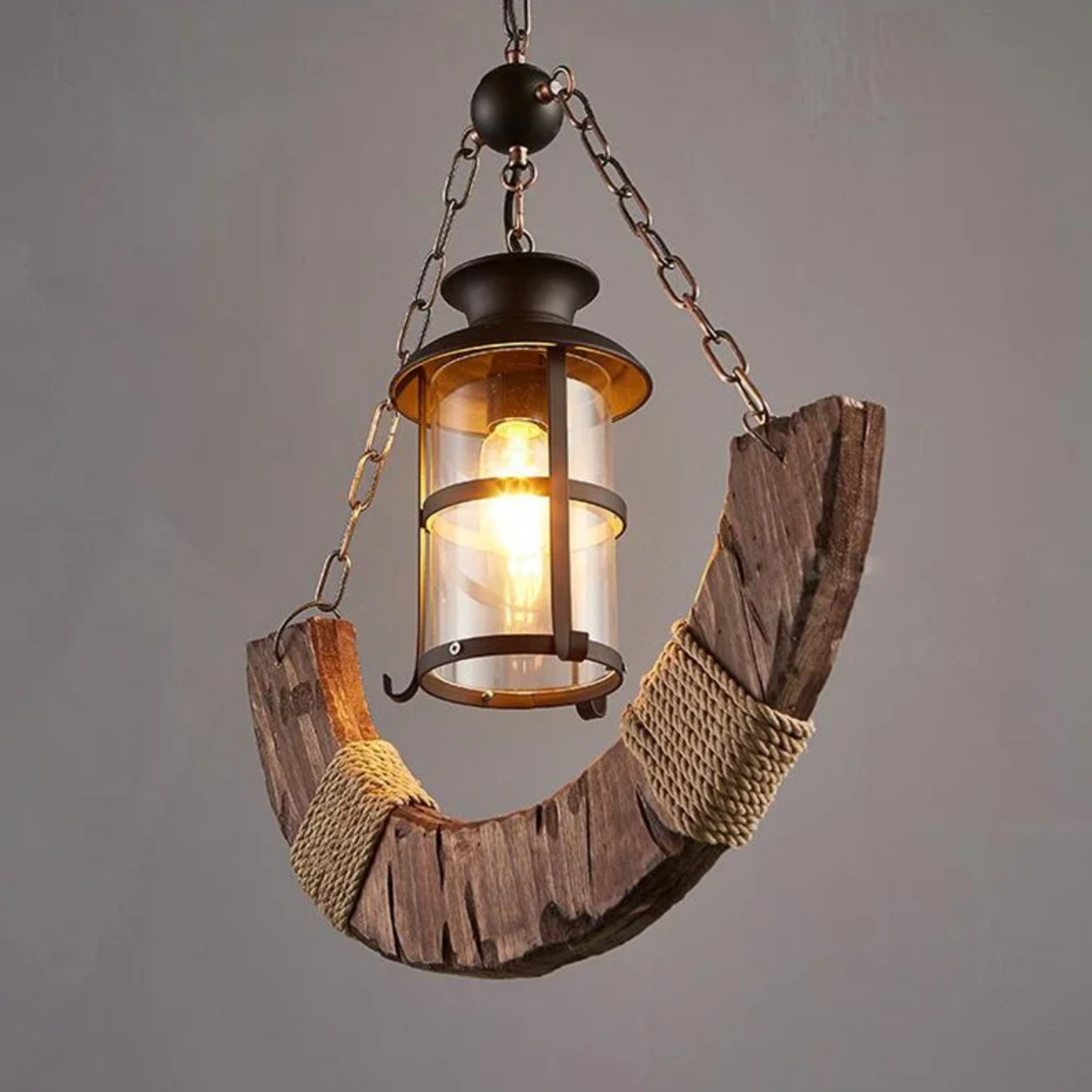 Side view of the rustic half moon wood and hemp rope chandelier