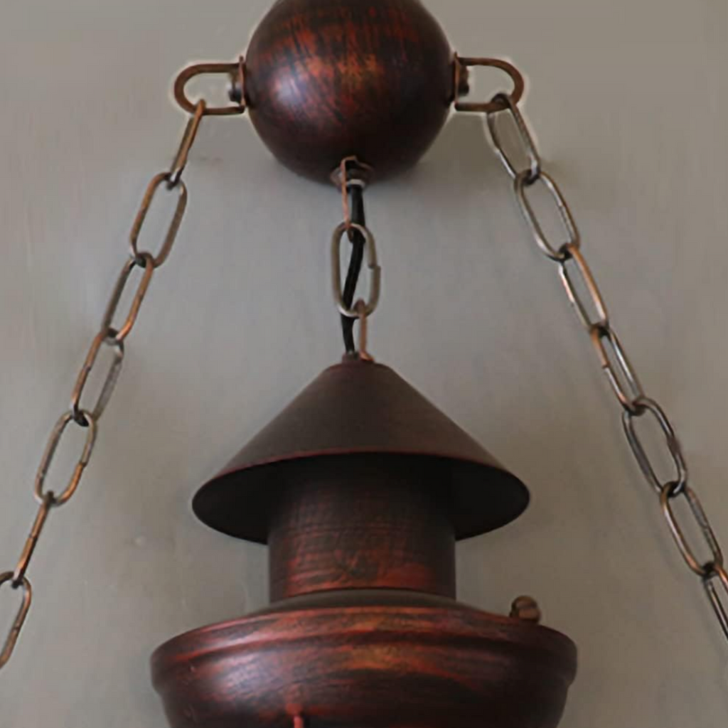 Metal frame detail of rustic glass pendant light