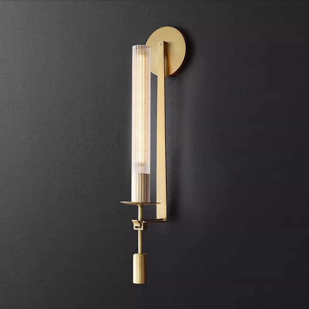 Scandinavian modern wall sconce with clear glass shade in gold