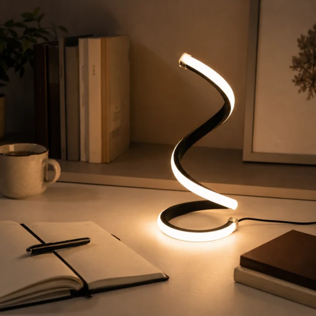 Sculptural LED table lamp on desk