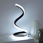 Sculptural snake LED table lamp in living room