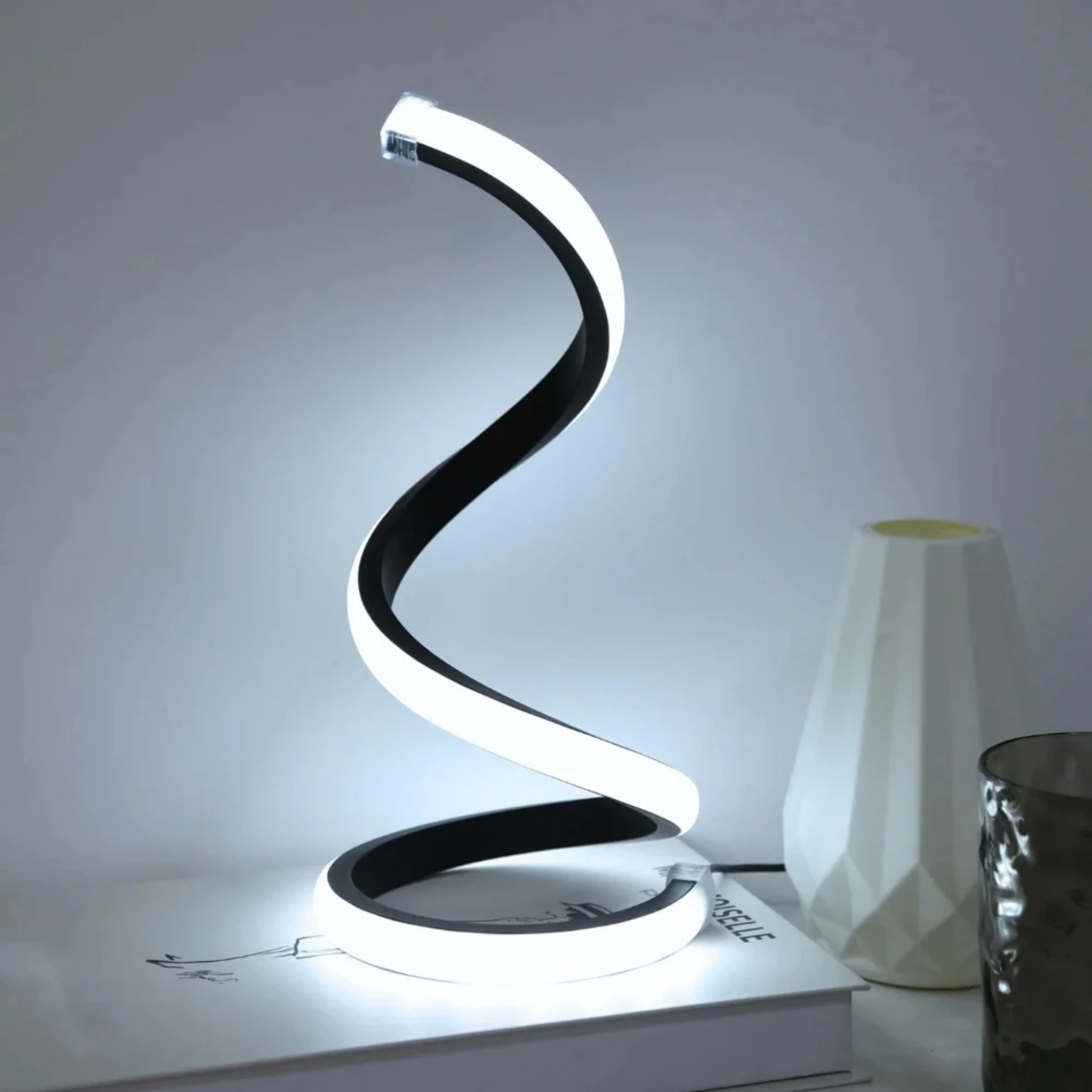 Sculptural snake LED table lamp in living room