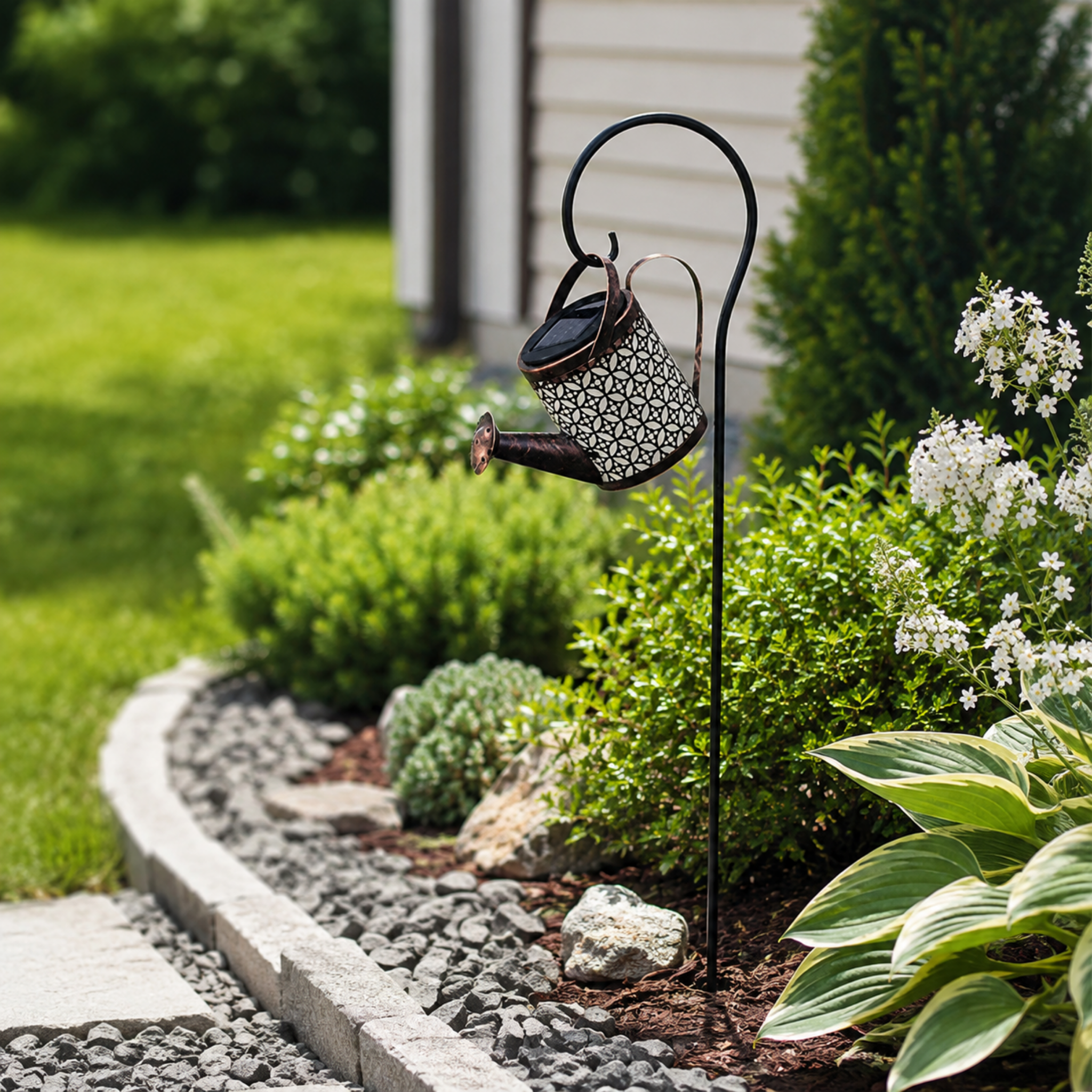 Solar watering kettle lamp in a backyard landscape