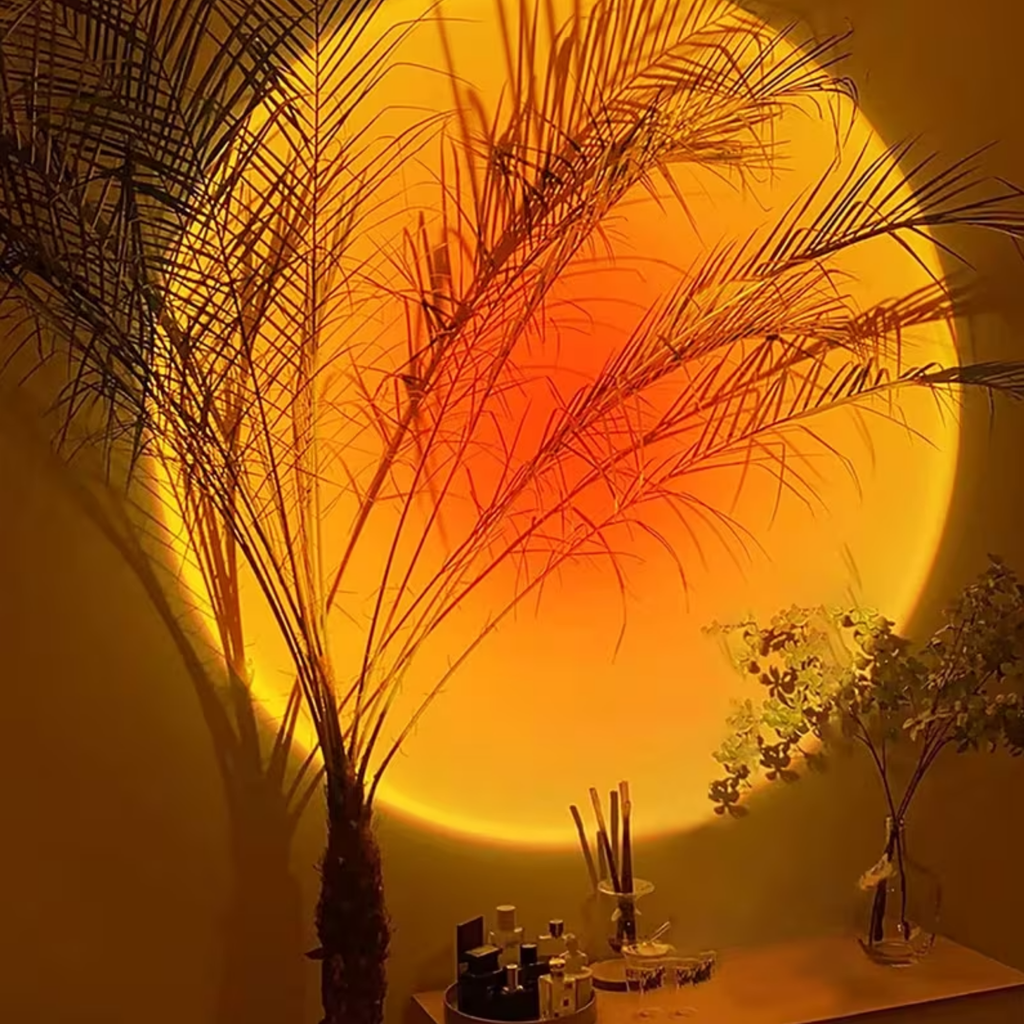 Sunset projection lamp creating a warm red glow