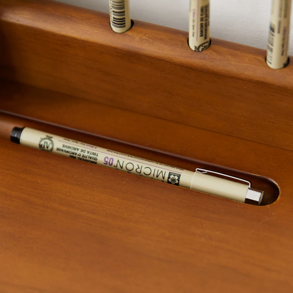 Details of the pine wood writing desk with stainless steel legs