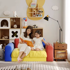Woman sitting on a colorful velvet sofa